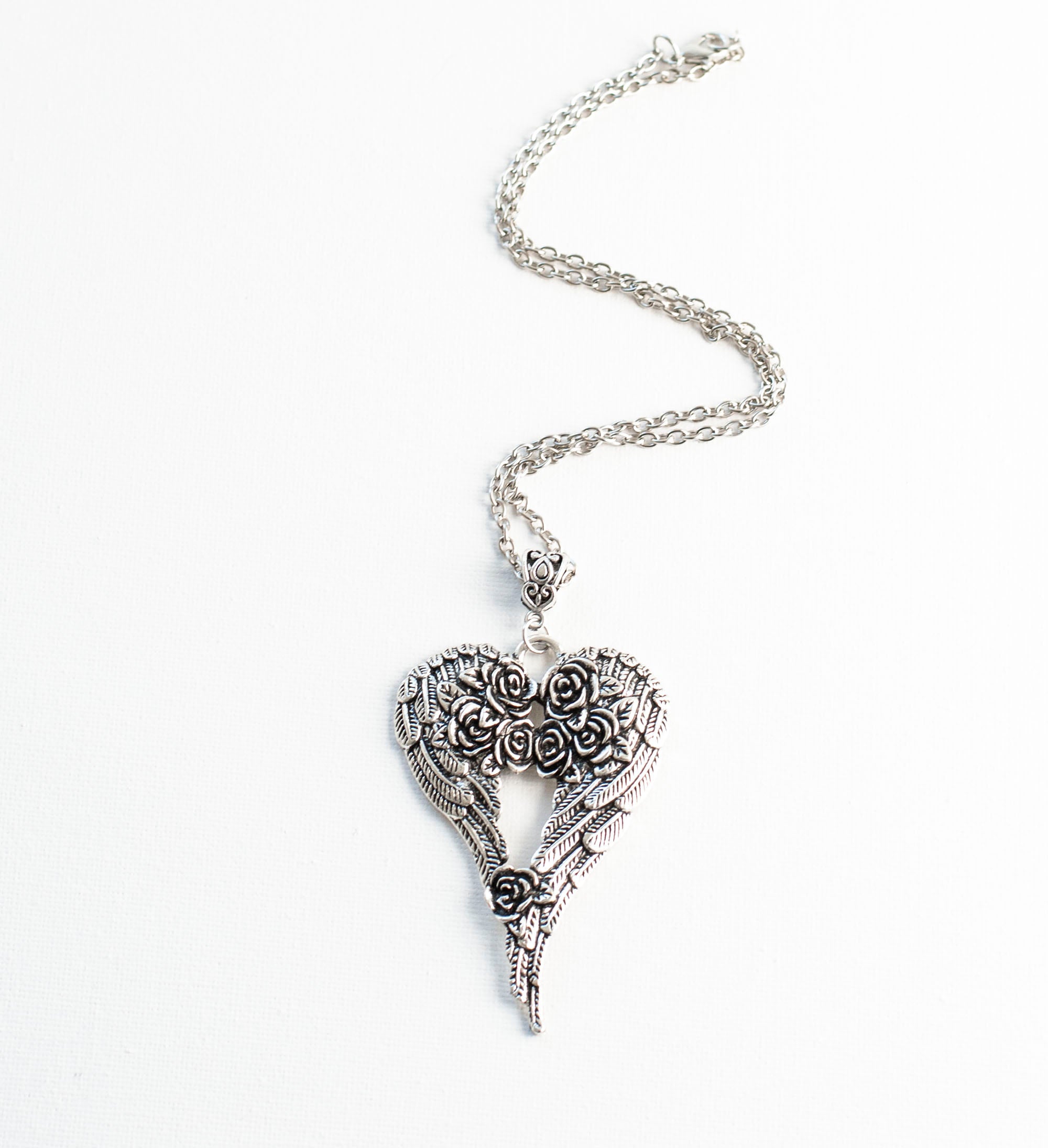Silver Heart shaped Angel Wings necklace with Roses