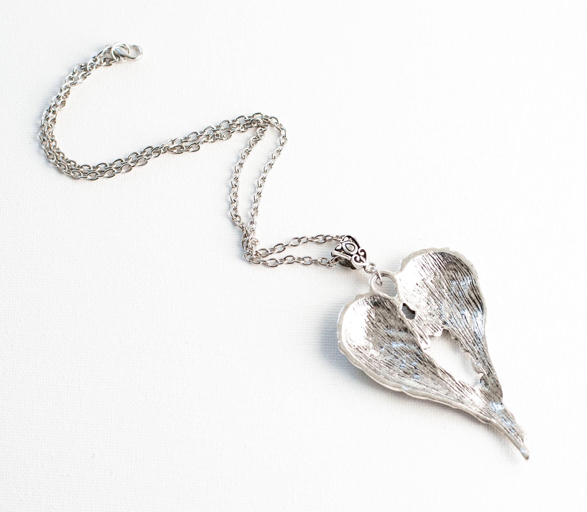 Heart necklace with angel wings online